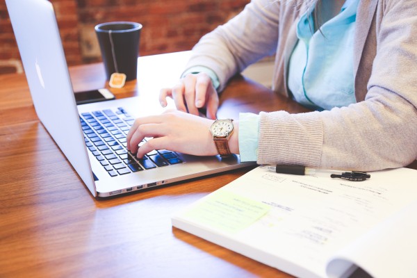 bee resources: a woman working on her computer
